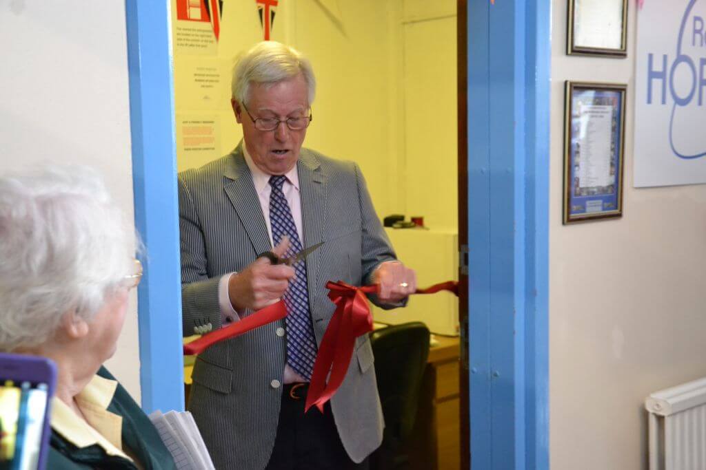 John Craven cuts the ribbon to mark the re opening of the Radio Horton studios