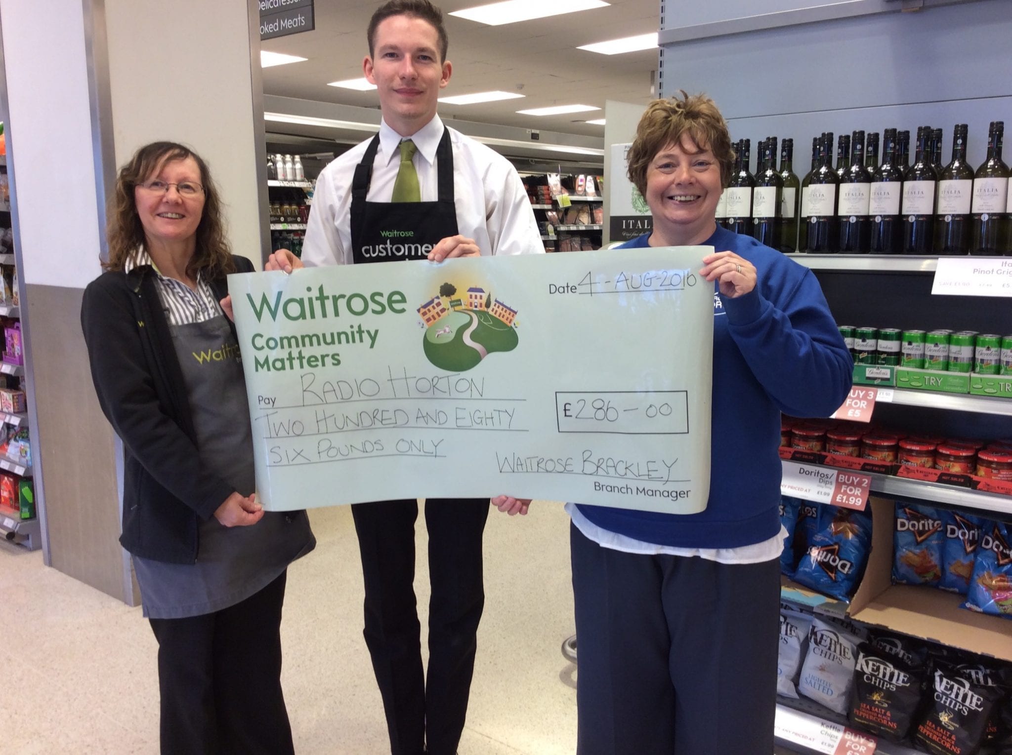 Mandy Rousell receives cheque from Waitrose